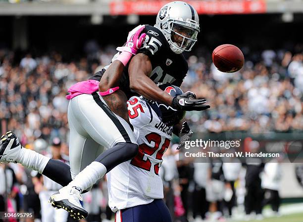 Defensive Back Kareem Jackson of the Houston Texans breaks up a pass in the endzone to wide receiver Darrius Heyward-Bey of the Oakland Raiders...