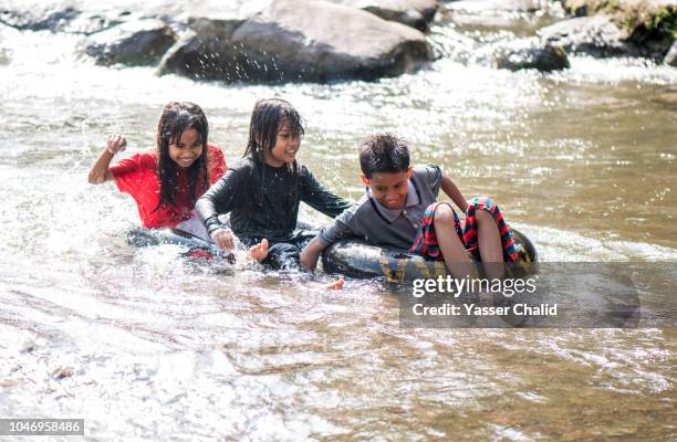 kids have fun in river - kids at river stock pictures, royalty-free photos & images