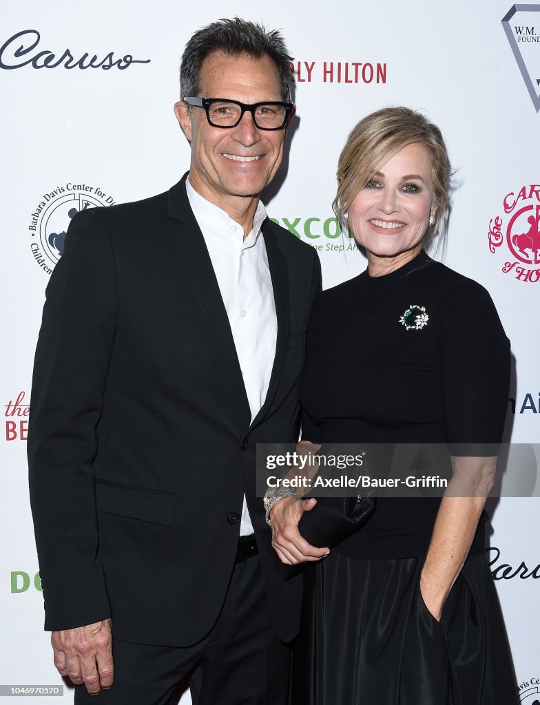 Mike Inik Maureen McCormick and Michael Cummings attend the 2018 Carousel of ...