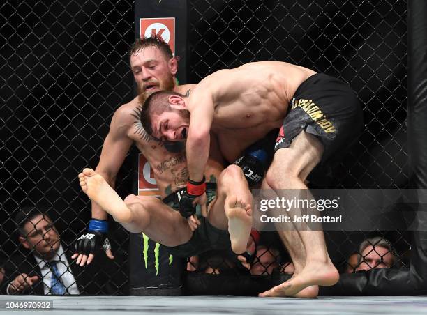 Khabib Nurmagomedov of Russia takes down Conor McGregor of Ireland in their UFC lightweight championship bout during the UFC 229 event inside...