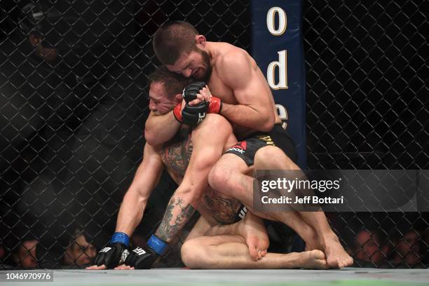 Khabib Nurmagomedov of Russia attempts to submit Conor McGregor of Ireland in their UFC lightweight championship bout during the UFC 229 event inside...