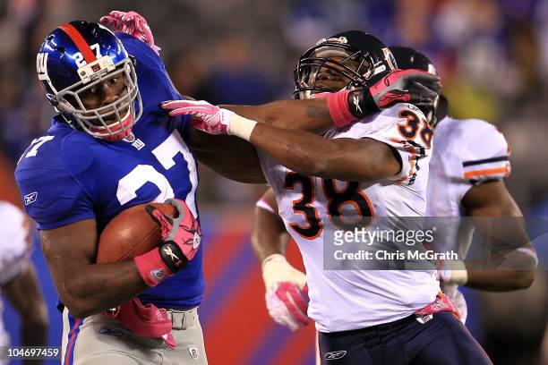 Brandon Jacobs of the New York Giants runs the ball against Danieal Manning of the Chicago Bears at New Meadowlands Stadium on October 3, 2010 in...