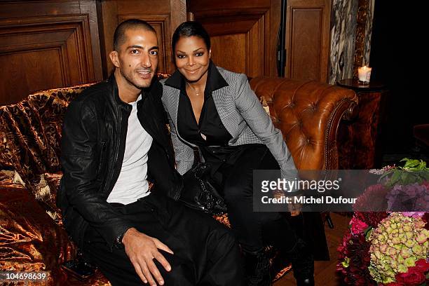 Wissam Al Mana and Janet Jackson attend the John Galliano Ready to Wear Spring/Summer 2011 show during Paris Fashion Week at Opera Comique on October...