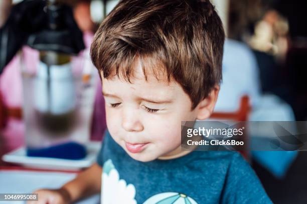 cute little boy playing indoors (closing his eyes) - child eyes closed stock pictures, royalty-free photos & images