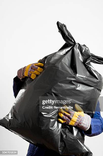 cleaner - man with garbage bag stock pictures, royalty-free photos & images