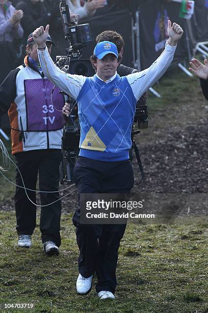 Rory McIlroy of Europe waves to the gallery as he walks to the first tee in the singles matches during the 2010 Ryder Cup at the Celtic Manor Resort...