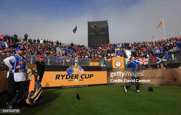 Martin Kaymer of Europe watches his tee shot on the first hole in the singles matches during the 2010 Ryder Cup at the Celtic Manor Resort on October...