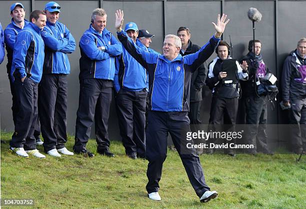The European Team Captain Colin Montgomerie waves to the gallery on the first tee in the singles matches during the 2010 Ryder Cup at the Celtic...