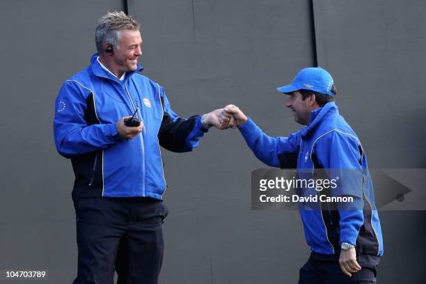 European Team vice-captains , Darren Clarke and Jose Maria Olazabal wait on the first tee in the singles matches during the 2010 Ryder Cup at the...