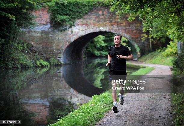 Prime Minister David Cameron runs along the Worcester and Birmingham Canal on the morning of October 4, 2010 in Birmingham, United Kingdom. Cameron...