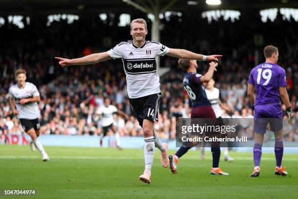 Andre Schurrle of Fulham celebrates after scoring his team's first goal during the Premier League match between Fulham FC and Arsenal FC at Craven...