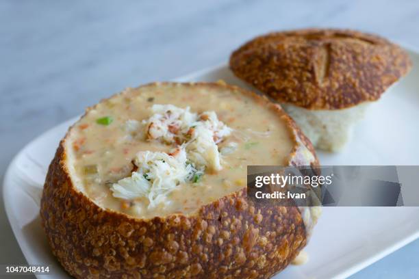 clam chowder, boudin's clam chowder with bread - clam chowder stock pictures, royalty-free photos & images