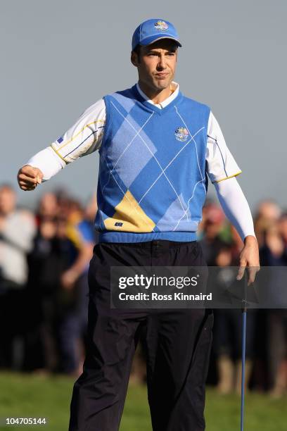 Ross Fisher of Europe celebrates holing a birdie putt on the 1st green in the singles matches during the 2010 Ryder Cup at the Celtic Manor Resort on...