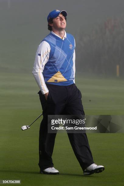 Rory McIlroy of Europe reacts to a putt on the third green in the singles matches during the 2010 Ryder Cup at the Celtic Manor Resort on October 4,...