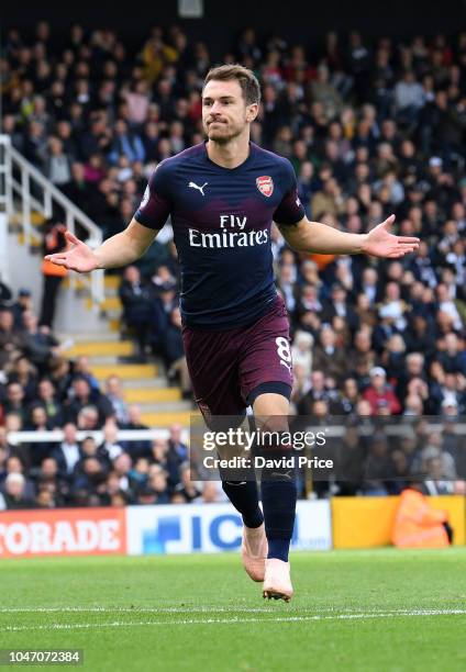 Aaron Ramsey celebrates scoring Arsenal's 3rd goal during the Premier League match between Fulham FC and Arsenal FC at Craven Cottage on October 7,...