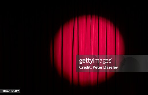 Spot light on red theatre curtains Spot light on red theatre curtains