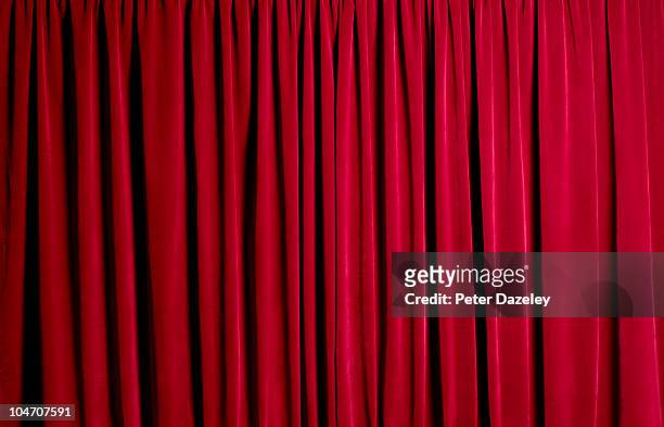 closed red theatre curtains - curtain fotografías e imágenes de stock
