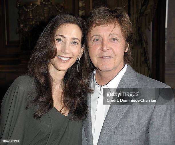 Sir Paul McCartney and Nancy Shevell attend the Stella McCartney Ready to Wear Spring/Summer 2011 show during Paris Fashion Week on October 4, 2010...