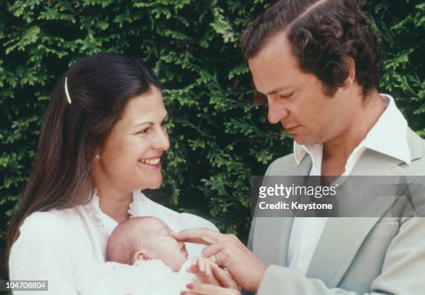 King Carl Gustaf XVI and Queen Silvia of Sweden with their baby daughter Princess Victoria at Solliden Castle on August 02, 1977.