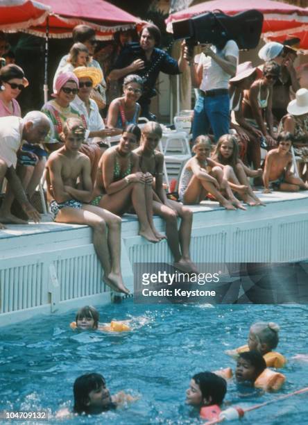 Princess Grace of Monaco and her children Princess Caroline and Prince Albert attend a swimming competition held at Palm Beach, Monte Carlo in 1972.