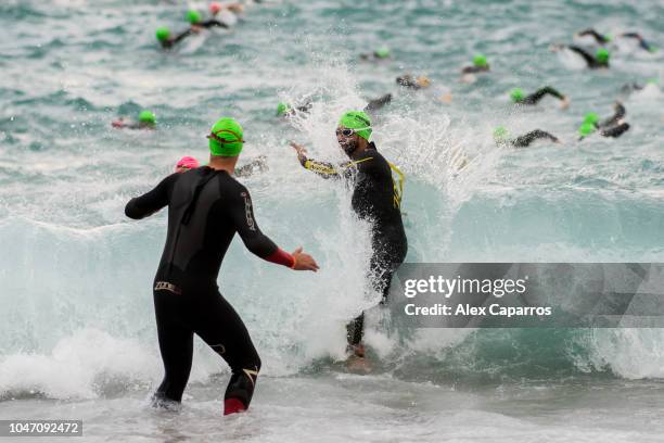 Athletes dive into the sea and start the swim leg of the race during IRONMAN Barcelona on October 7, 2018 in Barcelona, Spain.