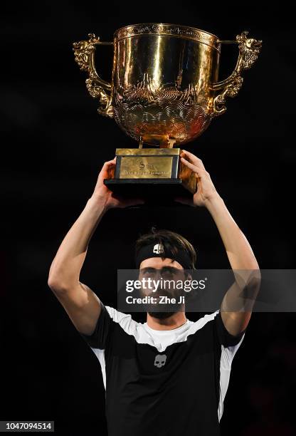 Nikoloz Basilashvili of Georgia holds the winner's trophy after winning the Men's Singles final against Juan Martin Del Potro of Argentina on day 9...