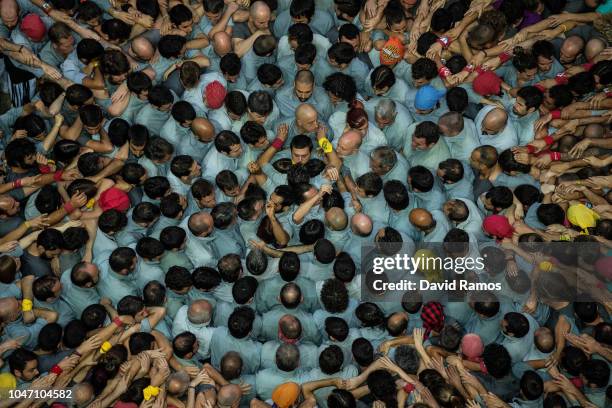 Members of the colla Castellers de Sants build a human tower during the 27th Concurs de Castells competition on October 7, 2018 in Tarragona, Spain....