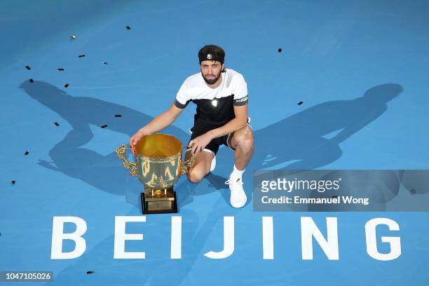 Nikoloz Basilashvili of Georgia hold the winner's trophy after winning his Men's Singles Finals match against Juan Martin Del Potro of Argentina on...