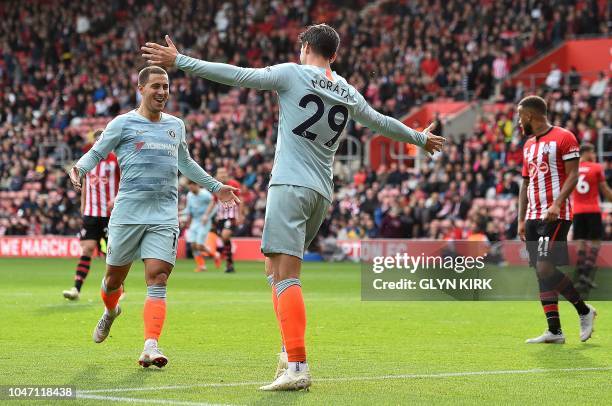 Chelsea's Spanish striker Alvaro Morata celebrates scoring his team's third goal with Chelsea's Belgian midfielder Eden Hazard during the English...