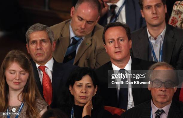 Prime Minister David Cameron and Marks and Spencer Chairman Sir Stuart Rose listen as Chancellor of the Exchequer George Osborne speaks at the...