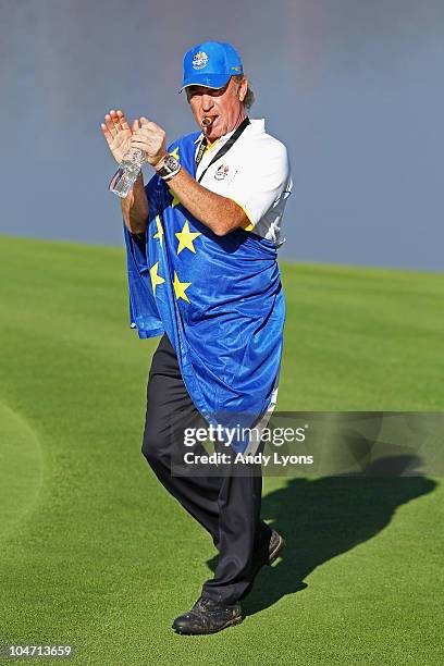 Miguel Angel Jimenez of Europe waves to the gallery in the singles matches during the 2010 Ryder Cup at the Celtic Manor Resort on October 4, 2010 in...