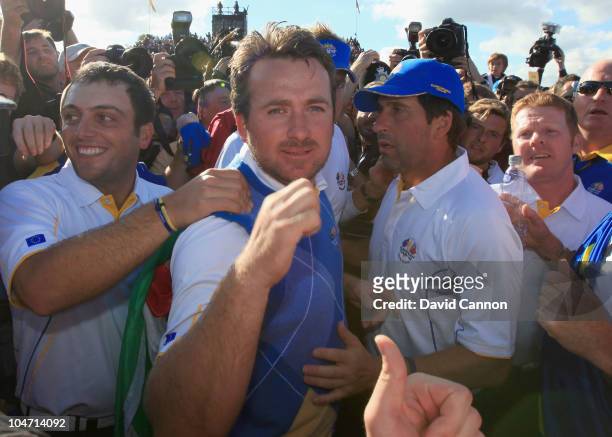Graeme McDowell of Europe celebrates his 3&1 win to secure victory for the European team on the 17th green in the singles matches during the 2010...
