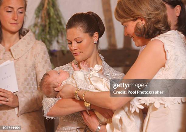 Princess Claire of Belgium, Princess Victoria of Sweden holding Princess Eleonore of Belgium and Princess Mathilde of Belgium participate in the...