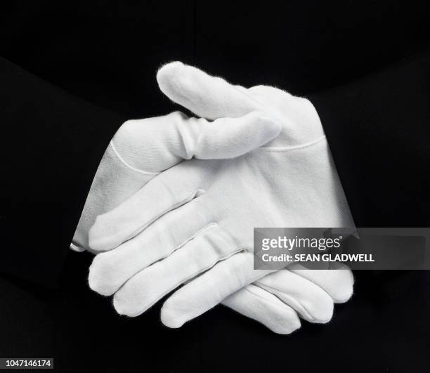 white gloves behind back - chauffeur stock pictures, royalty-free photos & images
