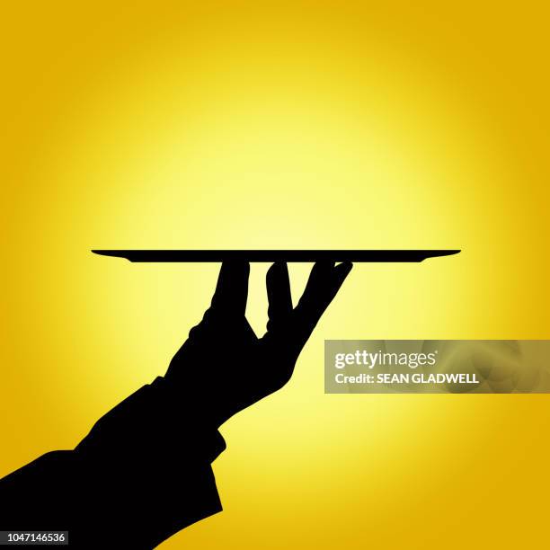 silhouette of butler holding tray - quality service concept imagens e fotografias de stock