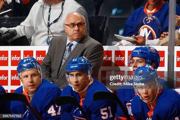 Headcoach Barry Trotz of the New York Islanders looks on from the bench against the Nashville Predators at Barclays Center on October 6, 2018 the...