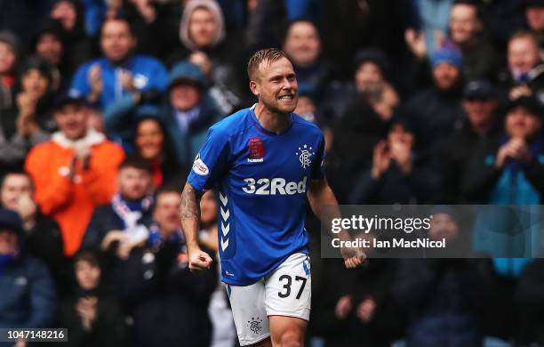 Scott Arfield of Rangers celebrates after he scores this team's third goal during the Scottish Ladbrokes Premiership match between Rangers and Hearts...