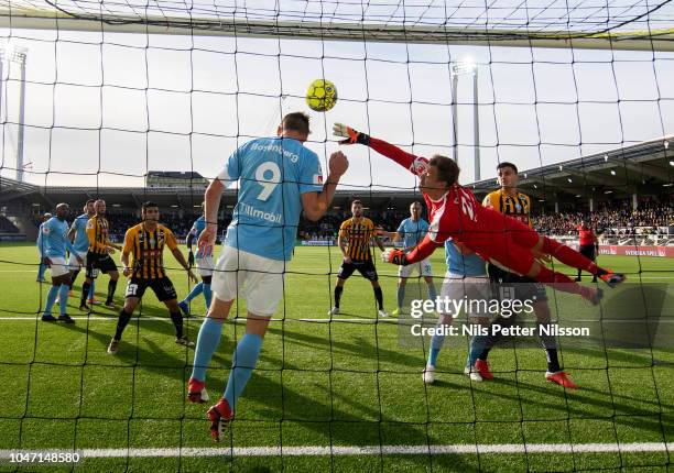 Markus Rosenberg and Johan Dahlin of Malmo FF makes a save during the Allsvenskan match between BK Hacken and Malmo FF at Bravida Arena on October 7,...