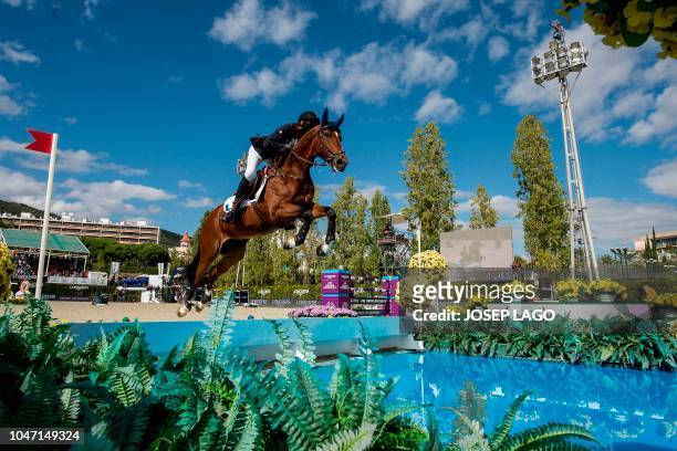 France's horseman Kevin Staut steers his horse For Joy Van't Zorgvliet HDC as they compete in the Longines FEI Jumping Nations Cup Final at the...