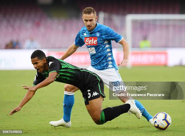 Marko Rog of SSC Napoli vies Rogerio of US Sassuolo during the Serie A match between SSC Napoli and US Sassuolo at Stadio San Paolo on October 7,...