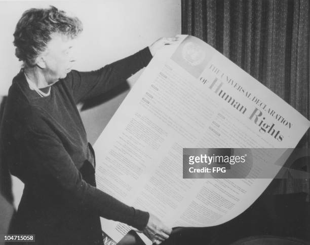 Eleanor Roosevelt , wife of Franklin Delano Roosevelt and First Lady of the United States from 1933 to 1945, holds up the Universal Declaration of...