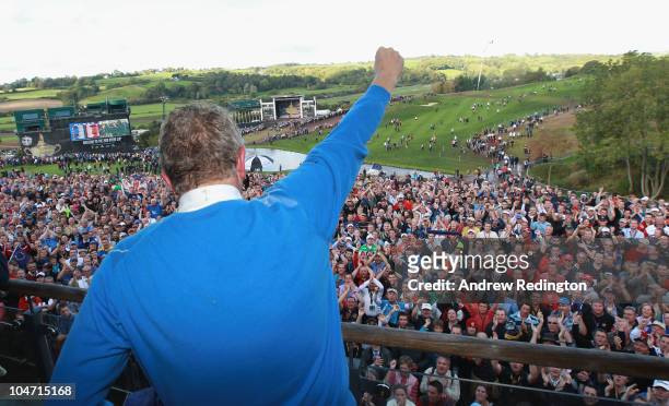 Colin Montgomerie of Europe salutes the crowd on the balcony of the clubhouse following Europe's victory during the 2010 Ryder Cup at the Celtic...