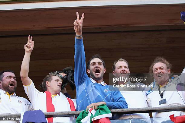 Luke Donald, Edoardo Molinari, Peter Hanson and Miguel Angel Jimenez celebrate on the blacony of the clubhouse following Europe's victory in the 2010...