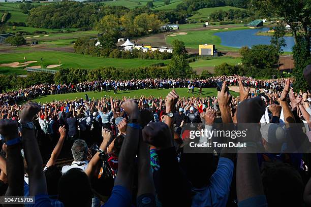 Graeme McDowell of Europe celebrates his 3&1 win over Hunter Mahan to secure victory for the European team on the 17th green in the singles matches...