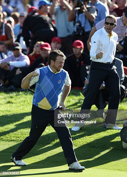 Graeme McDowell of Europe celebrates his birdie putt on the 16th green in the singles matches during the 2010 Ryder Cup at the Celtic Manor Resort on...