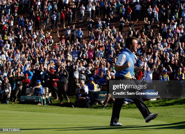 Graeme McDowell of Europe celebrates his birdie putt on the 16th green in the singles matches during the 2010 Ryder Cup at the Celtic Manor Resort on...