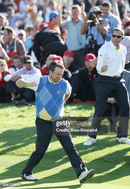 Graeme McDowell of Europe celebrates his birdie putt on the 16th green in the singles matches during the 2010 Ryder Cup at the Celtic Manor Resort on...