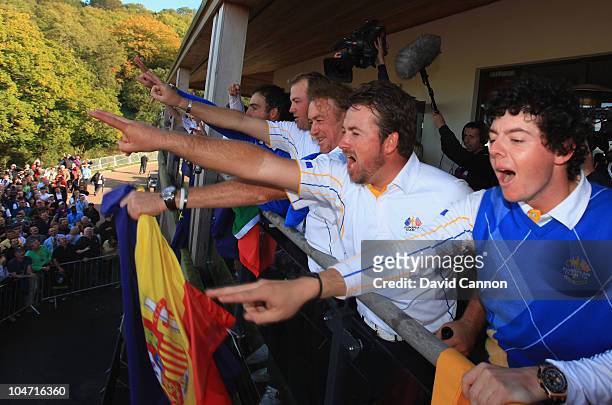 Graeme McDowell and Rory McIlroy celebrate on the balcony of the clubhouse following Europe's victory in the 2010 Ryder Cup at the Celtic Manor...