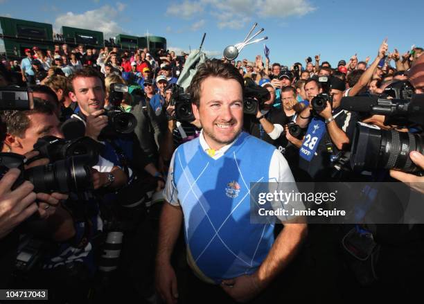 Graeme McDowell of Europe celebrates his 3&1 win to secure victory for the European team at the end of the singles matches during the 2010 Ryder Cup...