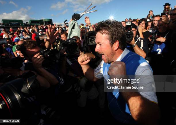 Graeme McDowell of Europe celebrates his 3&1 win to secure victory for the European team at the end of the singles matches during the 2010 Ryder Cup...